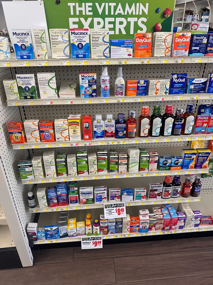 Store aisle at City Drugs stocked with over-the-counter products