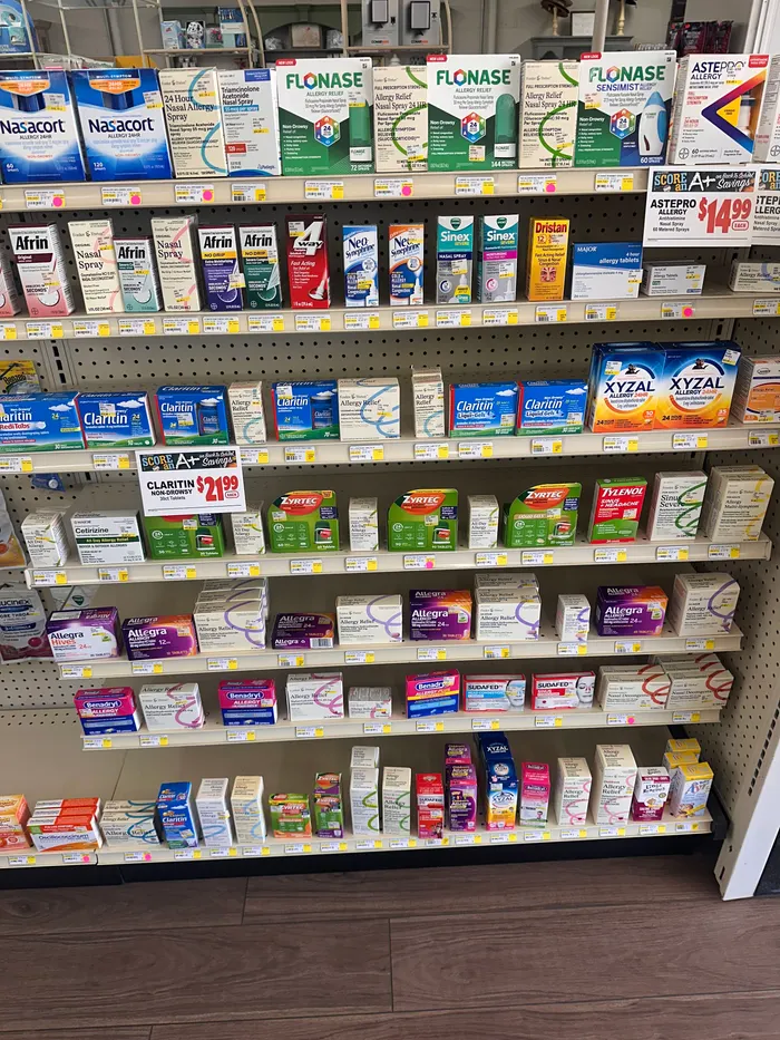 Store aisle at City Drugs stocked with over-the-counter products