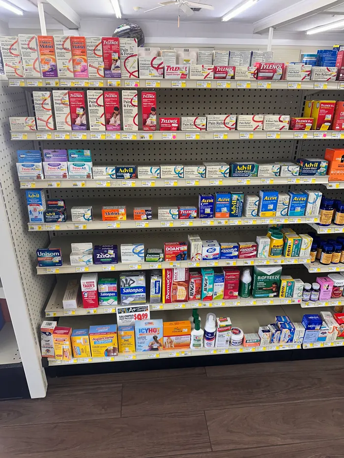 Store aisle at City Drugs stocked with over-the-counter products