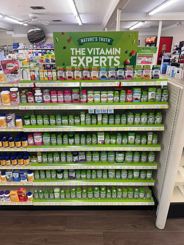 Store aisle at City Drugs stocked with over-the-counter products