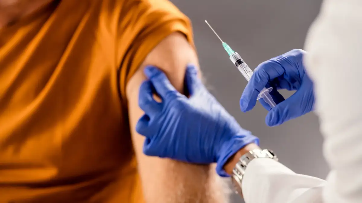 Pharmacist administering a vaccine to a patient